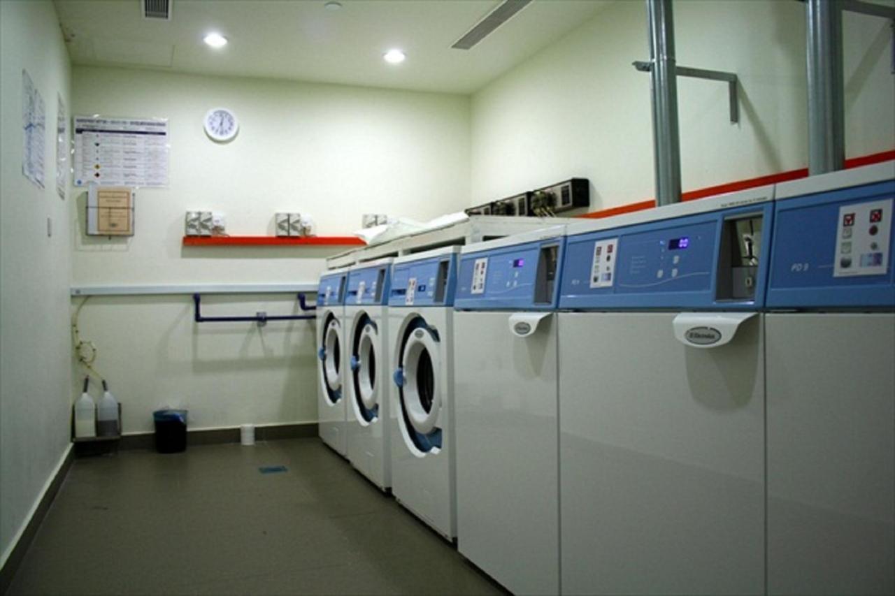 Parkroyal Serviced Suites Kuala Lumpur Exterior photo Laundry facilities at the station