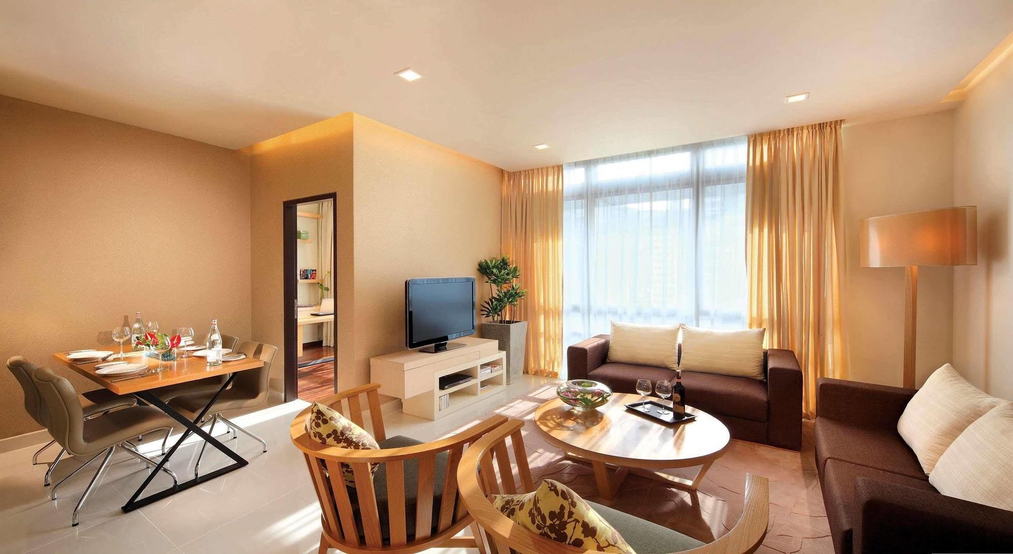 Parkroyal Serviced Suites Kuala Lumpur Exterior photo A living room in a serviced apartment in Beijing, China